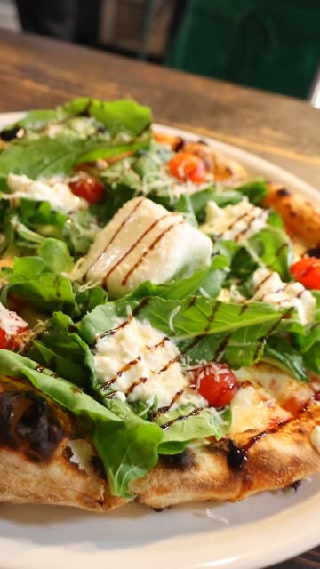 Wood-fired pizza with mozzarella and tomato